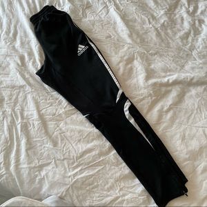 Adidas track pants with zippered ankles and elastic waist. Size Small.
